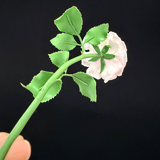 Handmade resin clay pink rose stem back view showing green wire stem and leaf construction detail – Sylva Garden