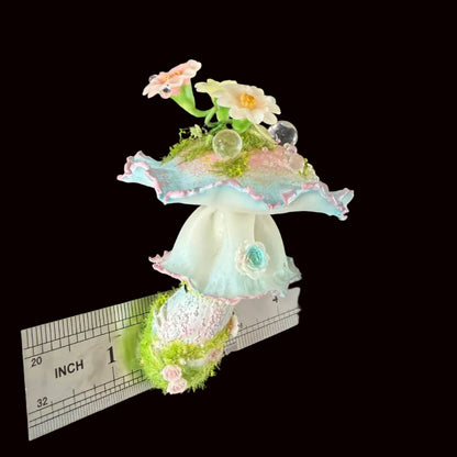 Handmade bloom veil fairy mushroom resin clay magnet with pastel ruffled cap daisy and crystal ball accents, front view with inch ruler on black background – Sylva Garden