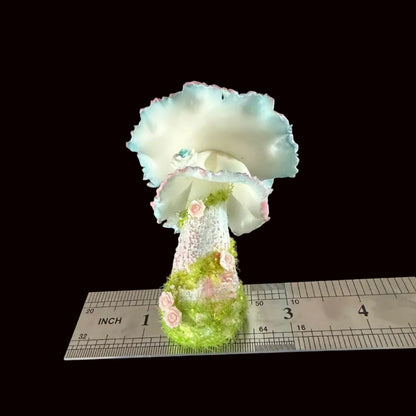 Handmade bloom veil fairy mushroom resin clay magnet full height view with ruffled blue pink cap rose stem and moss base, ruler showing approx 4 inches – Sylva Garden
