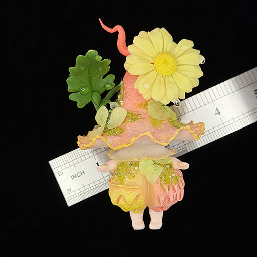 Handmade daisy wisp fairy mushroom resin clay magnet with yellow daisy ruffled pink cap and tiny legs, front view with ruler approx 3.5 inches – Sylva Garden