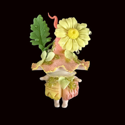 Handmade mauve daisy wisp mushroom resin clay magnet with pink ruffled cap purple daisy flowers and white curled tendril held in hand on black background 2 – Sylva Garden