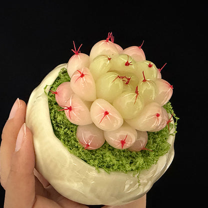 Handmade resin clay Haworthia rosette close-up showing plump translucent leaves with red spine tips and green moss in white lotus ceramic pot, held in hand – Sylva Garden