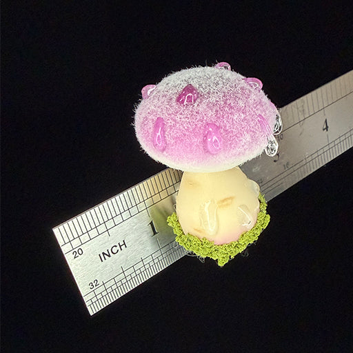 Handmade fluffy russula resin clay fridge magnet in purple showing fuzzy cap texture detail, angled view with ruler on black background – Sylva Garden