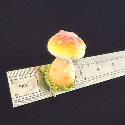 Handmade fluffy russula resin clay fridge magnet in orange yellow with moss base and size reference ruler on black background – Sylva Garden