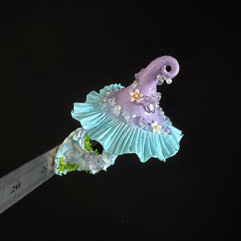 Lavender blue faerie mushroom witch hat resin clay fridge magnet with ruffled brim and floral accents, side view – Sylva Garden