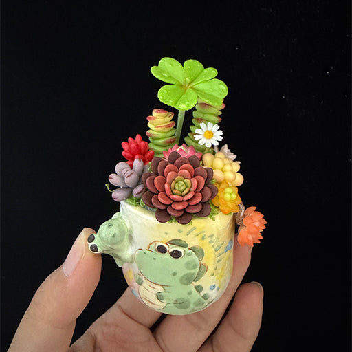 Little Croc Garden clay succulent held in hand — front view showing palm size