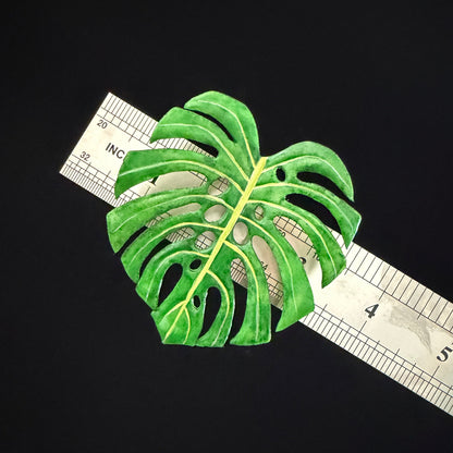 Handmade monstera leaf resin clay fridge magnet with terracotta base and moss accents, side view – Sylva Garden