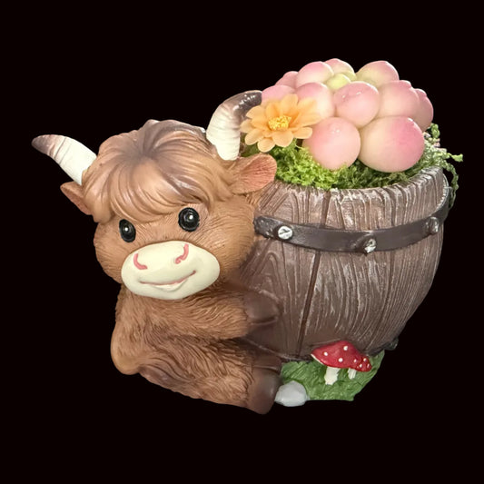 Handmade highland cow resin planter left side view showing brown cow face hugging wooden barrel with pink Peach Girl succulent orange flower moss and red mushroom base – Sylva Garden
