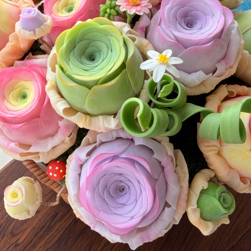 Rose Succulent Carnival handmade clay close-up showing purple lavender ranunculus with green curling tendrils white daisy and red mushroom accent detail in woven basket – Sylva Garden