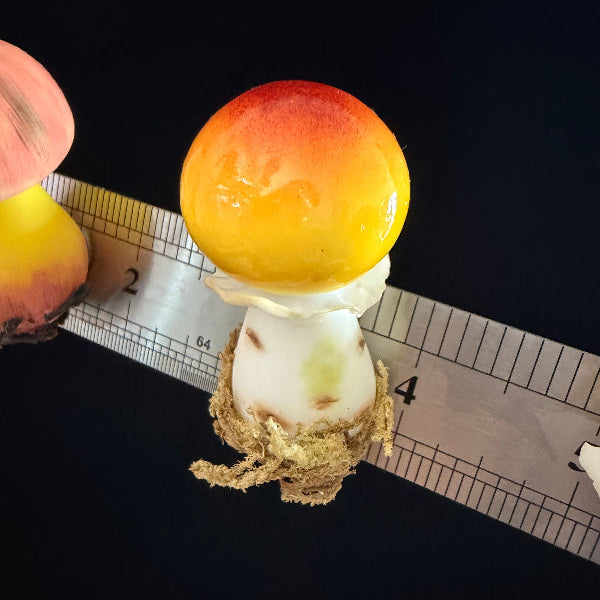 Three handmade russula mushroom resin clay fridge magnets in small medium and large sizes displayed on black background – Sylva Garden