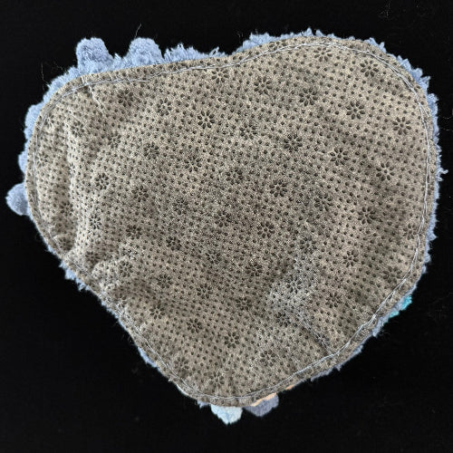 Handmade Tidal Moss blue white gradient pom-pom crochet coaster back view showing beige floral lace fabric base with light blue pom-pom border on black background – Sylva Garden